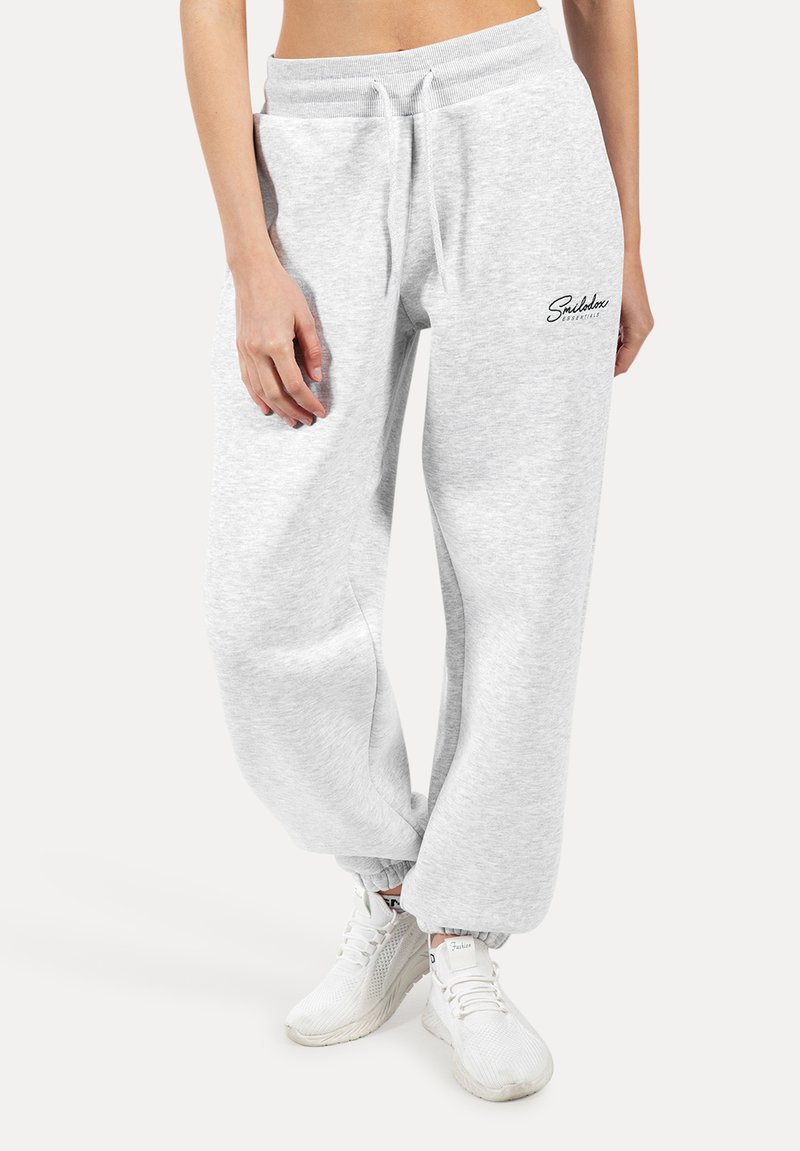 Graue Sweatpants mit lässiger Passform, elastischem Bund und gerippten Säumen. Verfügt über Seitentaschen und ein bedrucktes Logo-Detail.
