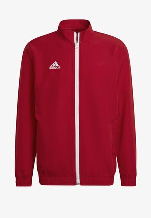 Giacca leggera rossa realizzata in tessuto liscio, con zip bianca, colletto alto e logo ricamato sul petto sinistro.