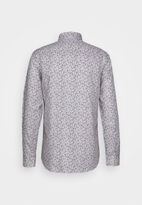 Langslivered shirt in lichte stof, met een blauw bloemenpatroon op een crèmekleurige achtergrond. Klassieke kraag en knoopmanchetten.