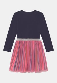 Long-sleeve dress with a navy top and a pink, multicolored striped tulle skirt, accented by a silver glitter waistband.