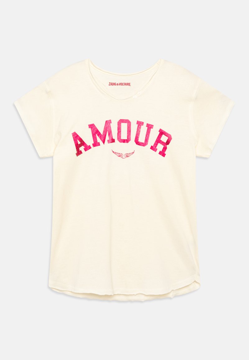 Kremfarget t-skjorte med korte ermer og rund hals, med "AMOUR" i stor rosa tekst og dekorative vinger under. Myk bomullsstoff.