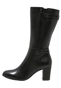 Black leather ankle boot with a sleek design, rounded toe, and a block heel. Features decorative straps and a smooth texture.
