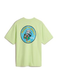 Light green t-shirt featuring a graphic print of a skull in a suit holding a drink, with the text “Hasta La Shaka” and "VANS."