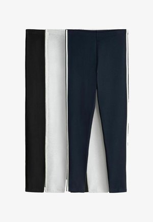 Trois paires de leggings slim en noir, gris clair et bleu marine, disposées côte à côte.