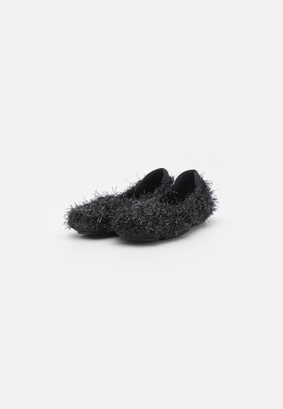 Black slip-on shoes covered in textured, metallic black fibers. Soft material with rounded toe and flexible sole.