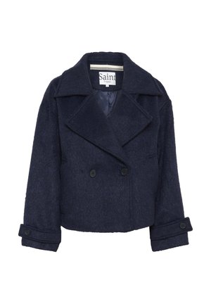 Giacca cropped in misto lana blu navy con ampi revers, chiusura doppiopetto con bottoni e polsini abbottonati. Fodera interna liscia.