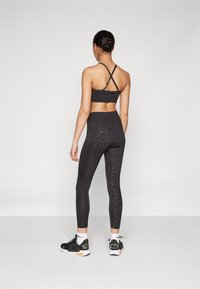 Puma INTERGALACTIC 7/8 - Leggingek - black