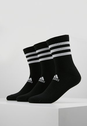 Black crew socks with three white stripes at the top and the Adidas logo on the side, featuring a ribbed texture for comfort and support.
