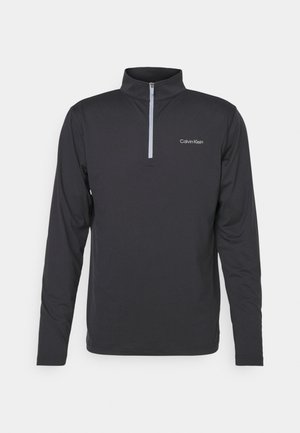 Black long-sleeve pullover with a quarter-zip neck. Features a logo on the left chest and smooth, lightweight fabric.