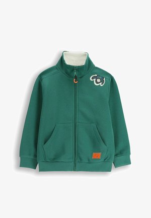 Zielona bluza na zamek z wysokim kołnierzem, podszewką z polaru, dwoma przednimi kieszeniami oraz pomarańczową metką "PRZYTUL MNIE", z kolorową naszywką zwierzęcą na piersi.