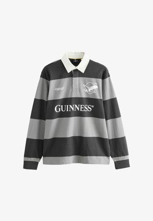 Long-sleeve rugby shirt with black and gray horizontal stripes, white collar, Guinness logo, and a bird holding a pint graphic on the chest.