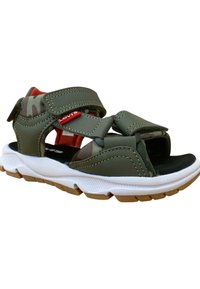 Sandalias sintéticas verdes con correas de Velcro, acentos de camuflaje, mediasuela blanca y suela exterior de goma texturizada.