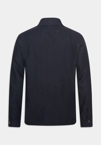 Navy blue long-sleeve shirt made of textured fabric, featuring a collar and buttoned cuffs, with a straight hem at the bottom.