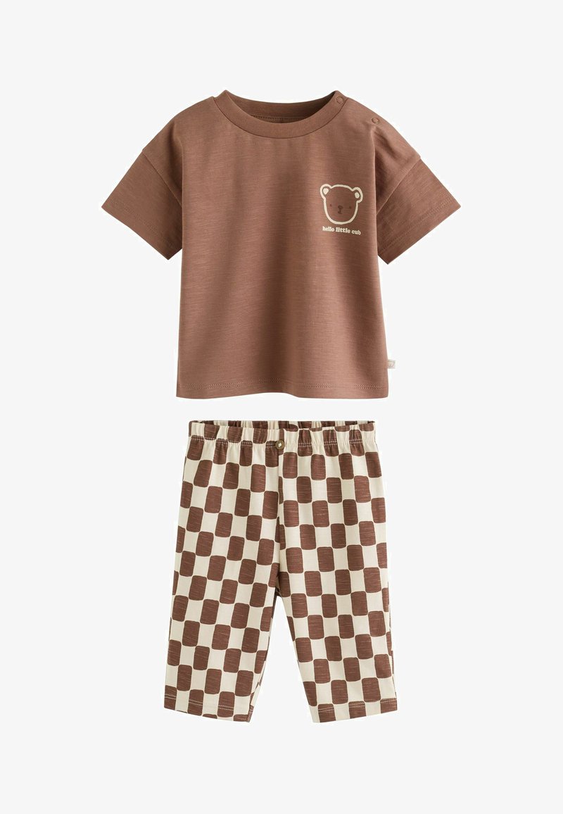 Brown short-sleeve toddler shirt with bear face and text "hello little cub," paired with beige and brown checkered pants with elastic waist.