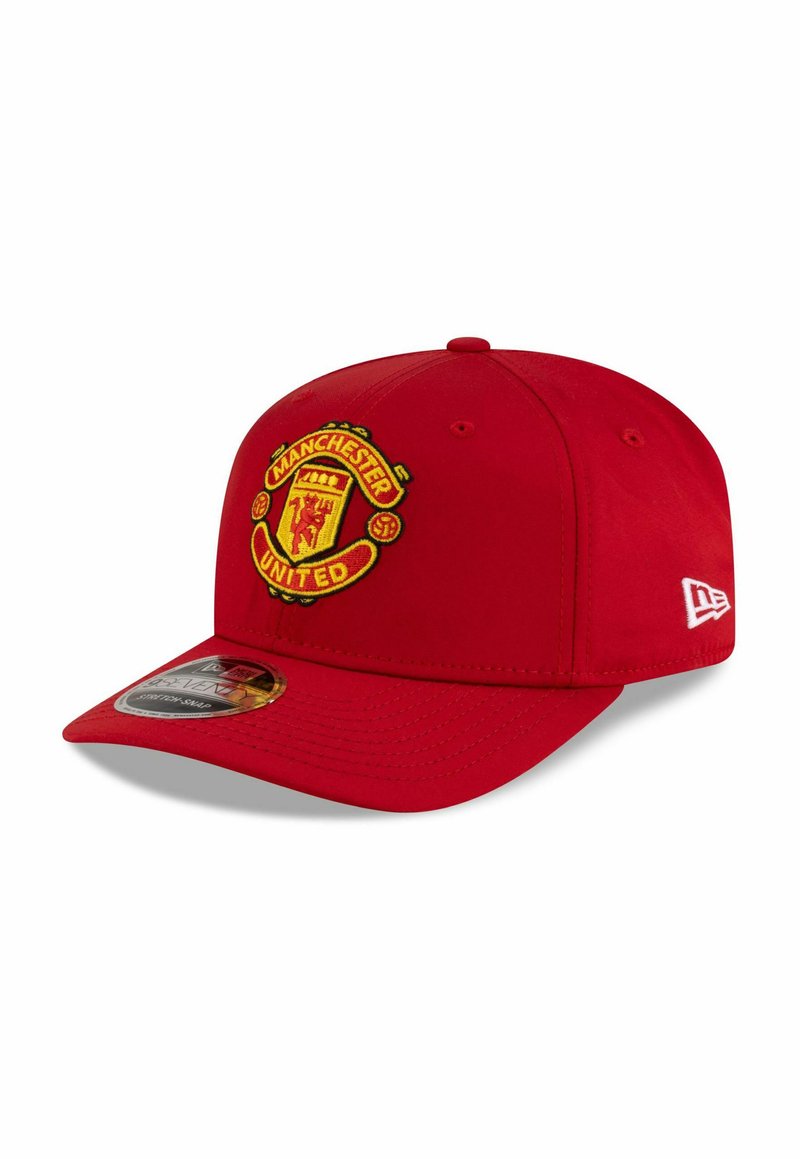 Red baseball cap with a curved brim and adjustable back. Features embroidered Manchester United logo on the front. Made from fabric.
