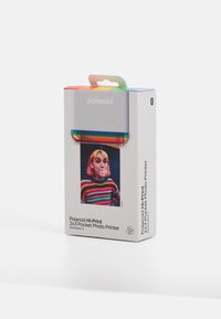 Polaroid Hi-Print 2x3 pocket photo printer packaging; silver box, colorful top, photo inset, branding in black text, minimalistic design.