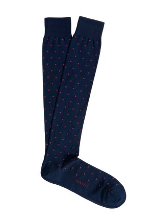 Calze al ginocchio blu navy con piccoli pois rossi e polsini a coste, con il nome del marchio "Perfil" sul piede.