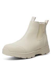 Botín impermeable beige hasta el tobillo con paneles laterales elásticos, punta redondeada, suela de goma texturizada y lengüetas para facilitar el calzado.