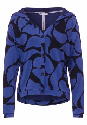 Cardigan à capuche bleu avec un motif de feuilles noires, boutons sur le devant et manches longues. Fabriqué à partir d'un matériau doux et extensible.