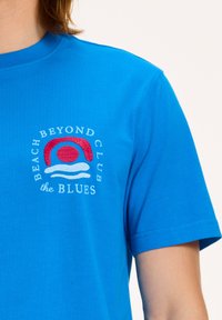 Shiwi Marškinėliai su spaudiniu - skydive blue