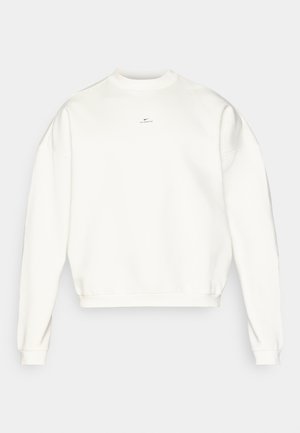 White sweatshirt with a crew neck, dropped shoulders, ribbed cuffs, and hem. Features a small black Nike logo on the chest. Basic design.