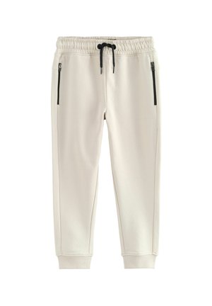 Lys beige sweatpants med slim fit, elastisk talje og justerbar snor, med to sidelommer med lynlås og ribbede manchetter.