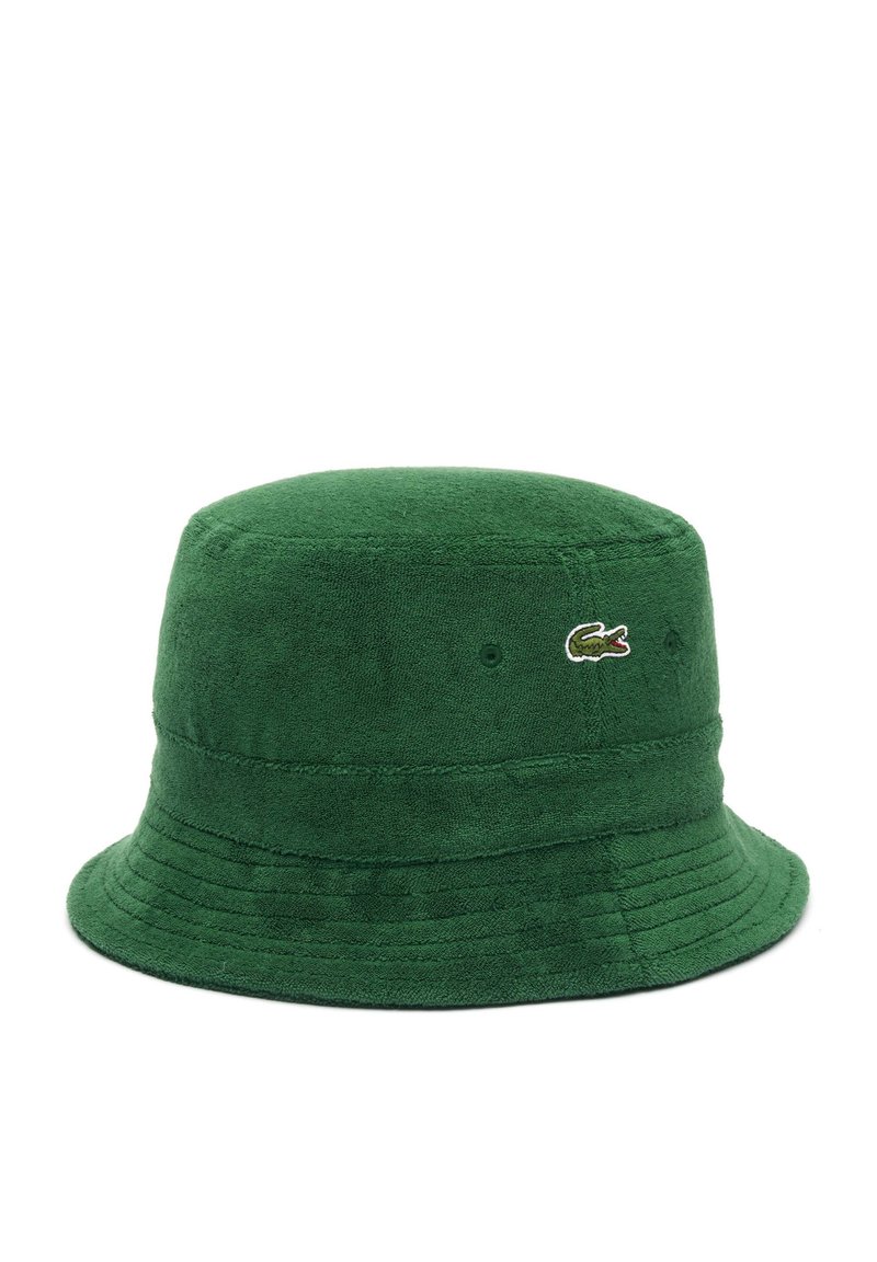 Zielony kapelusz typu bucket z frotte, o zaokrąglonej koronie i szerokim, opadającym brzegu. Posiada małe haftowane logo z boku.