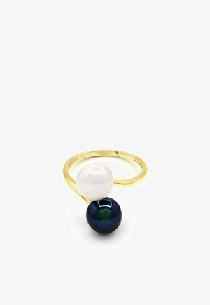 Bague en or au design ouvert, ornée d'une perle blanche et d'une perle noire se faisant face.