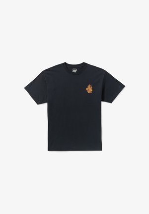 T-shirt en coton noir à manches courtes et col rond, ornée d'un petit logo de flamme orange et jaune sur la zone gauche de la poitrine.