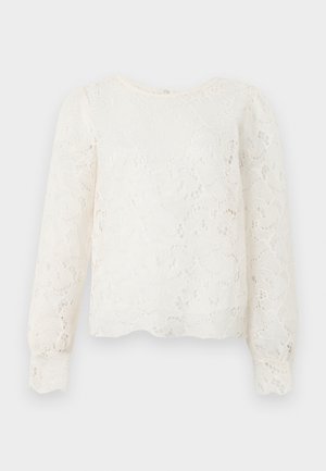 Λευκό μπλουζάκι μακρυμάνικο από δαντέλα με λουλουδένια μοτίβα, στρογγυλή λαιμόκοψη και ελαφρώς φουσκωτούς ώμους.