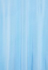 Light blue fabric with a smooth texture, featuring gentle folds and gradients, creating a soft and calming visual effect.