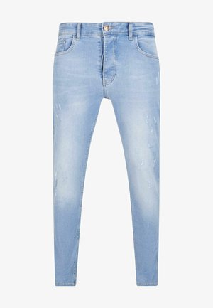 Heledad sinine teksapüksid, millel on kitsas lõige, reitel kulunud detailid ja klassikaline viie taskuga disain.