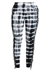 Leggings noir et blanc à motifs tie-dye avec une coupe ajustée, ornés d'accents à franges sur les côtés. Tissu doux, taille élastique.