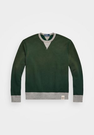 Ciemnozielona bluza z jasnoszarym kołnierzem, mankietami i dołem, z trójkątnym detalem szwu pod kołnierzem oraz małą metką na dole.
