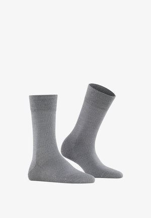 Calze in cotone grigio con una zona a coste, lunghezza fino al polpaccio, texture liscia, rinforzo sulla punta e sul tallone per garantire durata.
