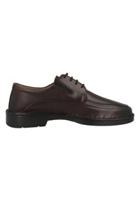 Chaussure en cuir marron à lacets avec une texture lisse, un bout arrondi et une semelle en caoutchouc noir contrastante. Elle présente des détails de coutures subtils.