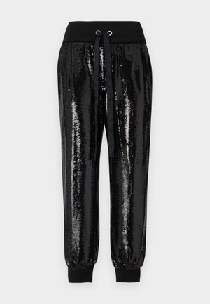 Schwarze Pailletten-Jogginghosen mit elastischem Bund. Verfügt über einen Kordelzugverschluss und schmal zulaufende Knöchellöcher. Glatte Textur mit glänzender Oberfläche.