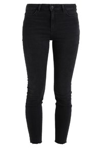 Černé úzké džíny vyrobené z denimu, s vysokým pasem, pěti kapsami, jemným vyblednutím a třepicími detaily na lemu.