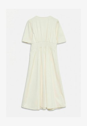 Robe midi écrue à manches courtes, taille froncée et jupe évasée, vue de dos sur fond blanc.