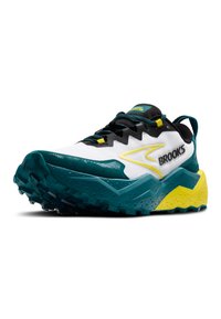 Zapatilla de trail running con un upper blanco y acentos en azul, amarillo y negro, suela texturizada y un patrón de taco agresivo para agarre.