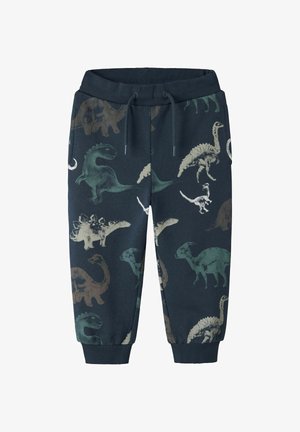 Dinosaur-mønstret sweatpants i marineblå. Fremstillet af blødt stof, med elastisk talje og manchetter, prydet med forskellige dinosaur-illustrationer.