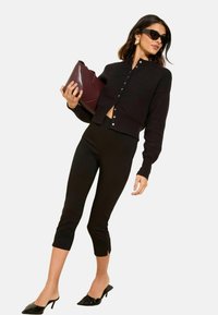 - SCULPTING STRETCH - Trousers - black
