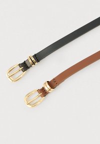 Two slim leather belts, one black and one brown, each with a shiny gold buckle and matching belt loops on a white background.