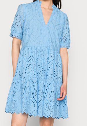 Light blue dress made of eyelet fabric, featuring a V-neck, short sleeves, and a tiered skirt with scalloped hem and intricate patterns.