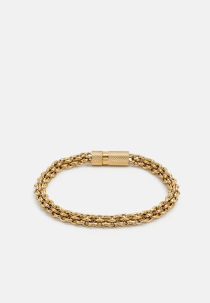 Gold chain bracelet featuring interwoven links, a textured clasp, and a smooth surface. Measures approximately 1 cm in width.