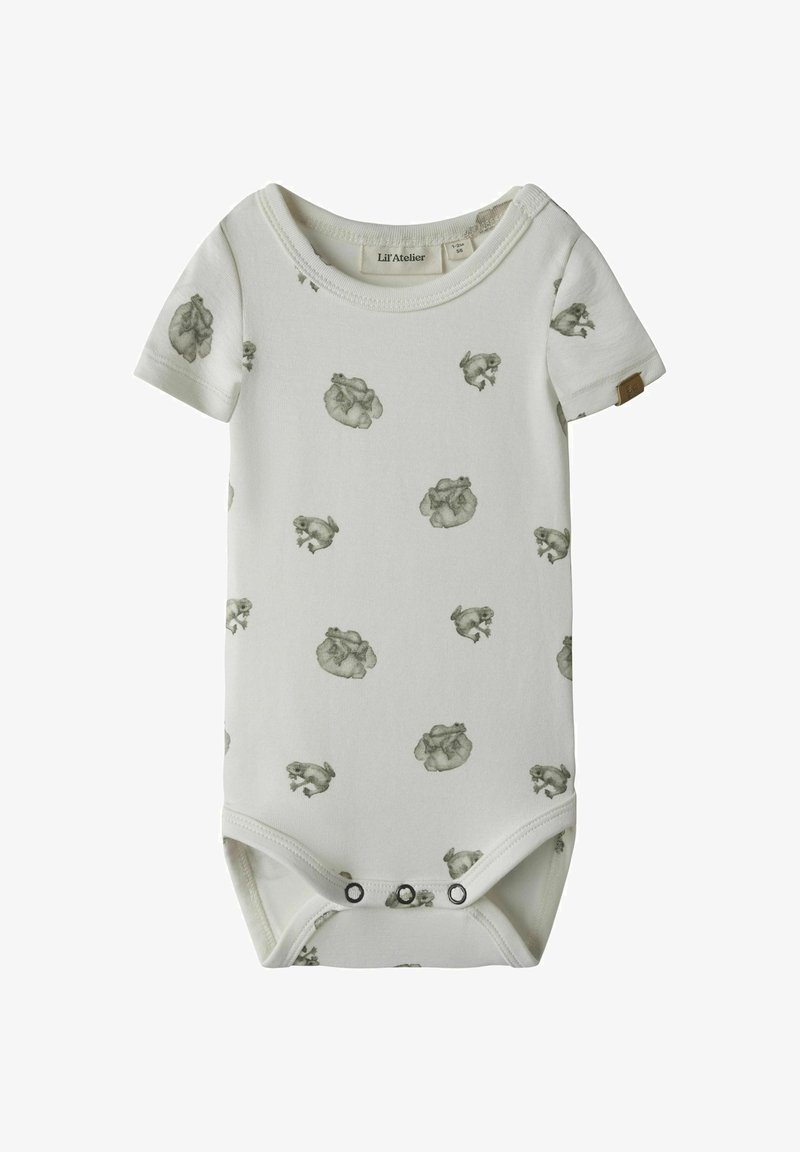 Kremo spalvos kūdikių bodis iš švelnaus medvilnės, su pakartotiniu žaliu triušiuku spaudiniu, trumpomis rankovėmis ir spaudėmis apačioje.