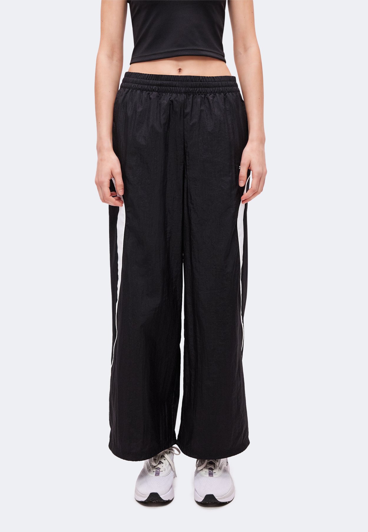 PUMA SPORT RELAXED WOVEN PANTS - Tracksuit bottoms - black