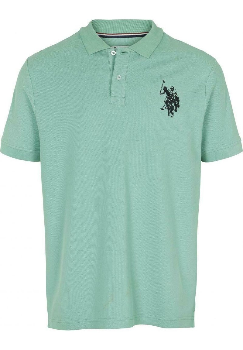 Pikétröja i ljusgrön bomull med en strukturerad yta, med en svart broderad design på vänster bröst och en klassisk krage.