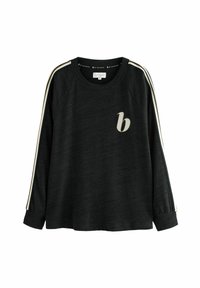 Zwarte sweatshirt met lange mouwen en raglanmouwen, met crèmekleurige strepen aan de zijkanten en een klein beige logo op de voorkant. Zachte textuur.