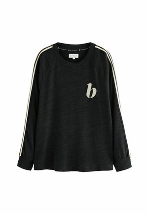 Mustat pitkät hihaiset collegepaidat, joissa on raglan-hihat, jossa on kerma värisiä raitoja sivuilla ja pieni beige logo edessä. Pehmeä tekstuuri.